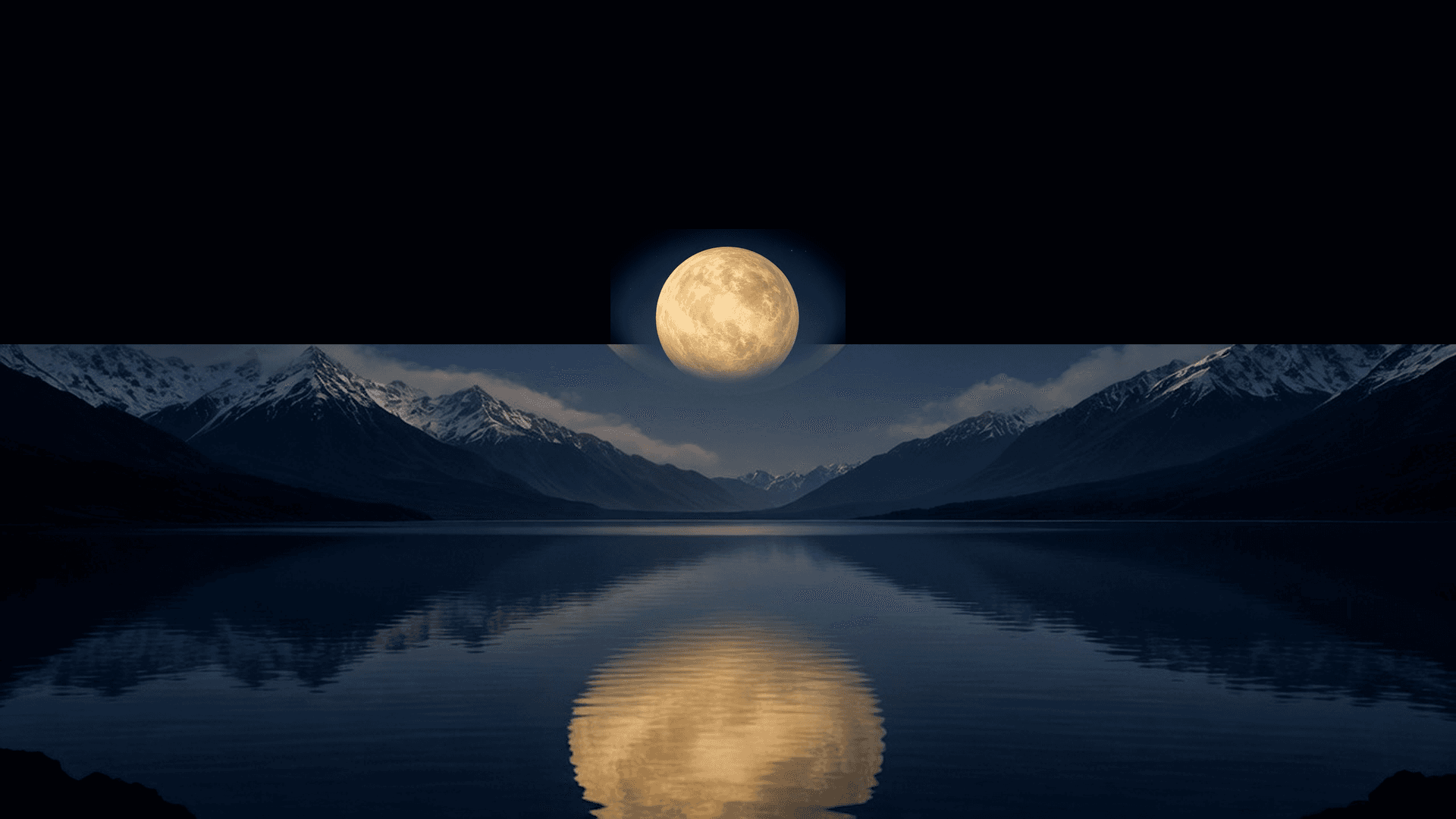 A pale planet just beginning to rise behind dark mountains.